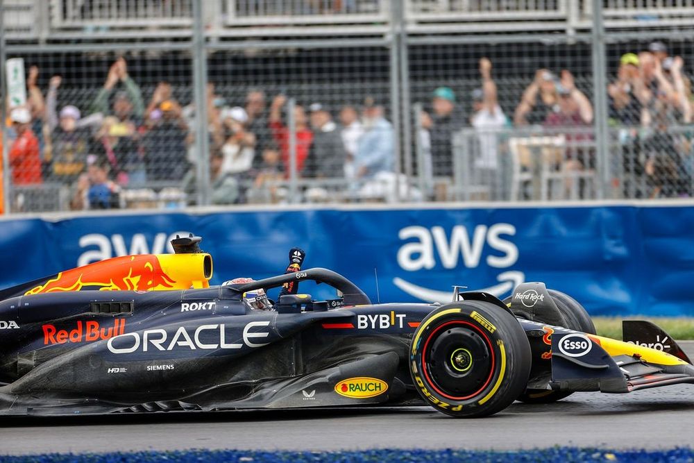 Max Verstappen, Red Bull Racing RB20, celebrates on track after winning the race