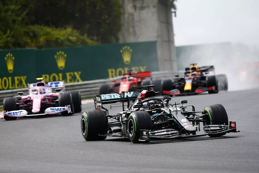 Lewis Hamilton, Mercedes F1 W11 leads Lance Stroll, Racing Point RP20 at the start of the race