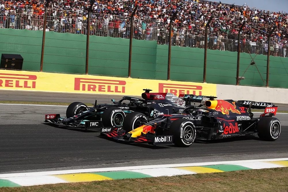 Max Verstappen, Red Bull Racing RB16B, battles with Lewis Hamilton, Mercedes W12