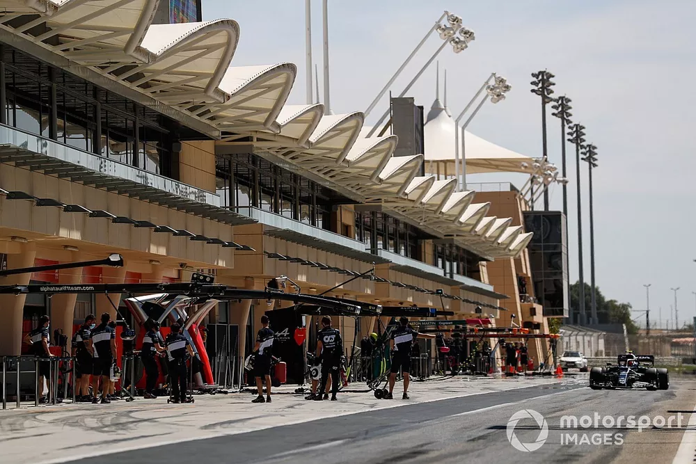 Pierre Gasly, AlphaTauri AT02, drives along the pitlane to his garage