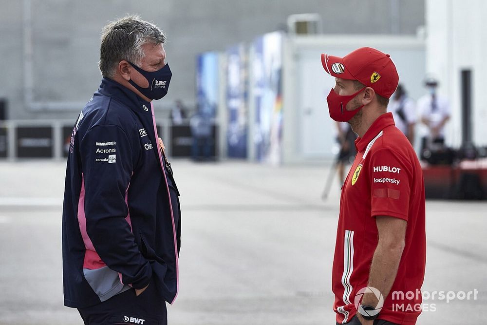 Otmar Szafnauer, Team Principal and CEO, Racing Point and Sebastian Vettel, Ferrari in the paddock