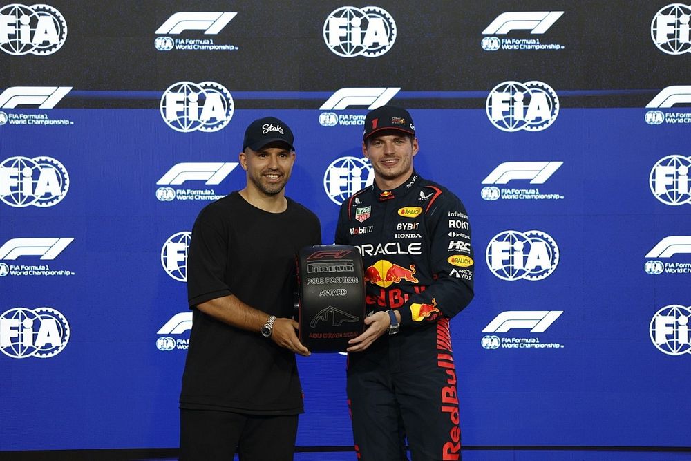 Former footballer Sergio Aguero presents Max Verstappen, Red Bull Racing, with his Pirelli Pole Position Award