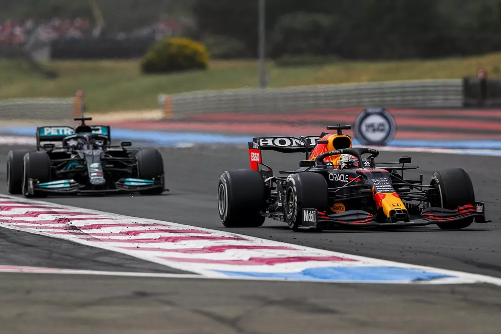 Max Verstappen, Red Bull Racing RB16B, leads Sir Lewis Hamilton, Mercedes W12