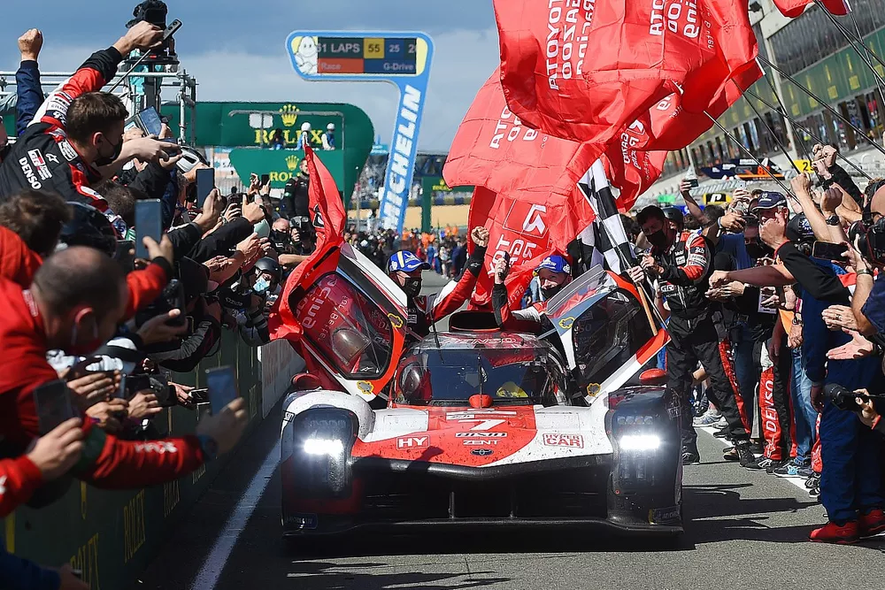 Mike Conway, Kamui Kobayashi, Jose Maria Lopez, #7 Toyota Gazoo Racing Toyota GR010 - Hybrid Hypercar celebrate victory.