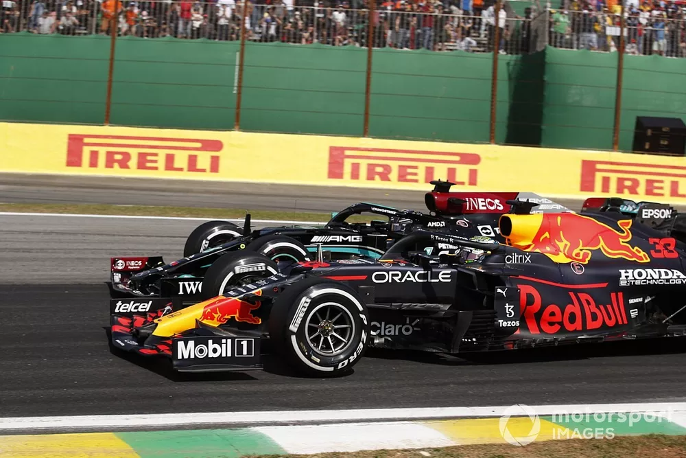 Max Verstappen, Red Bull Racing RB16B, battles with Lewis Hamilton, Mercedes W12