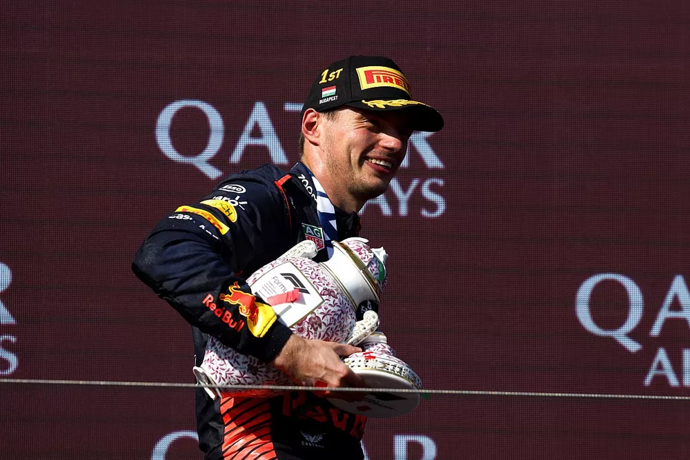 Max Verstappen, Red Bull Racing, 1st position, leaves the podium with the bits of his broken trophy