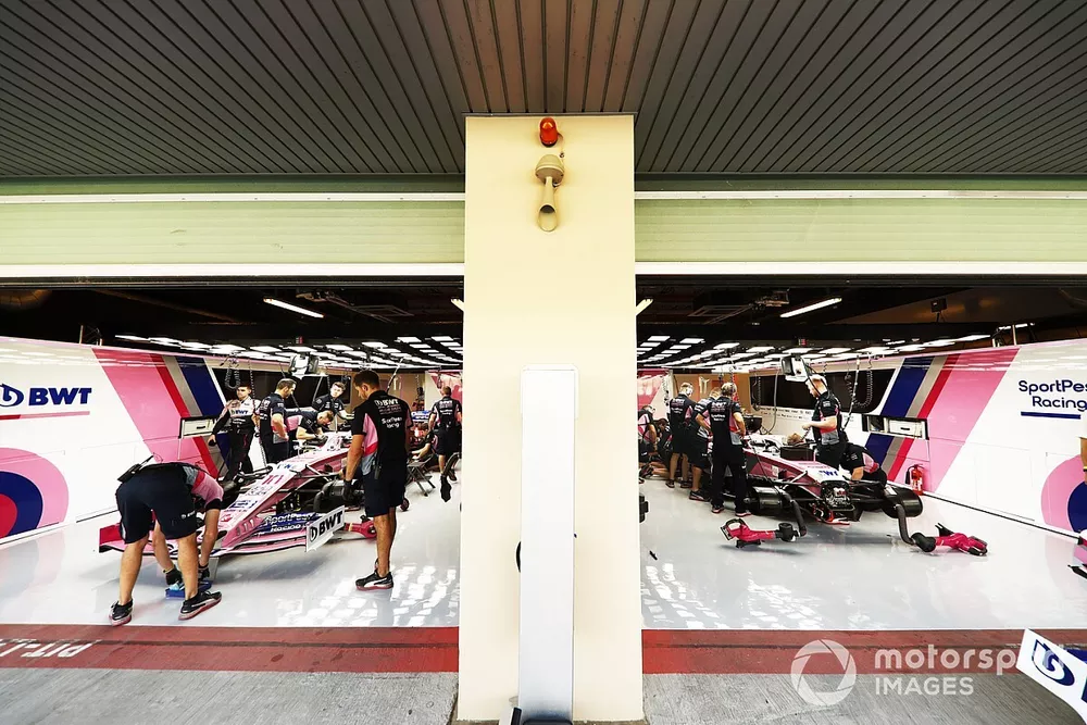 Lance Stroll, Racing Point RP19, and Sergio Perez, Racing Point RP19, in the garage