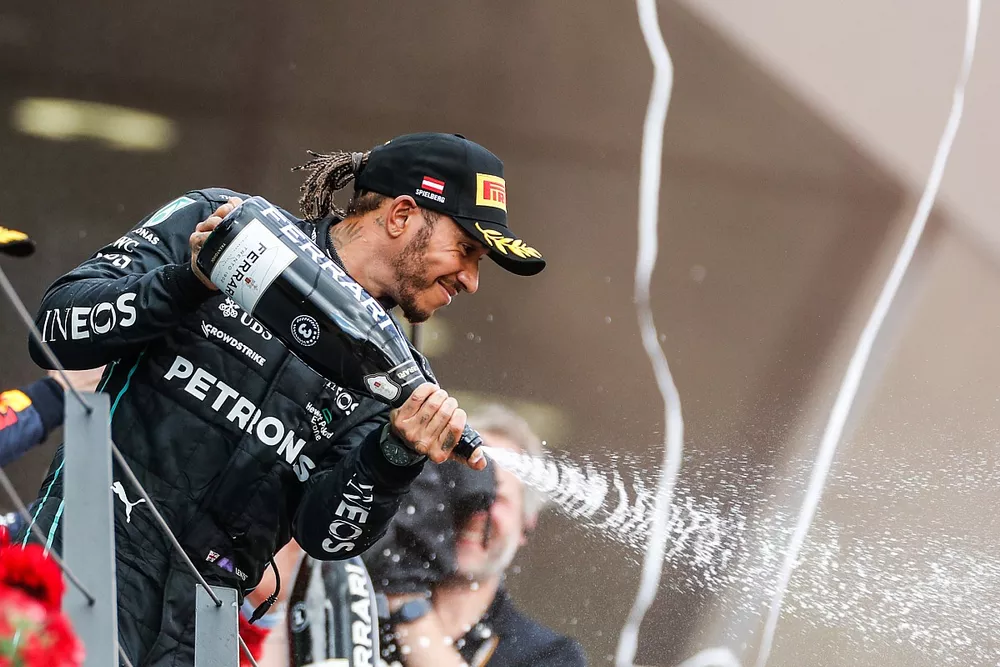 Lewis Hamilton, Mercedes-AMG, 3rd position, sprays Champagne from the podium