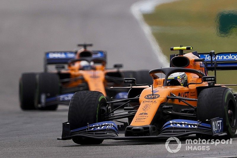 Lando Norris, McLaren MCL34, leads Carlos Sainz Jr., McLaren MCL34