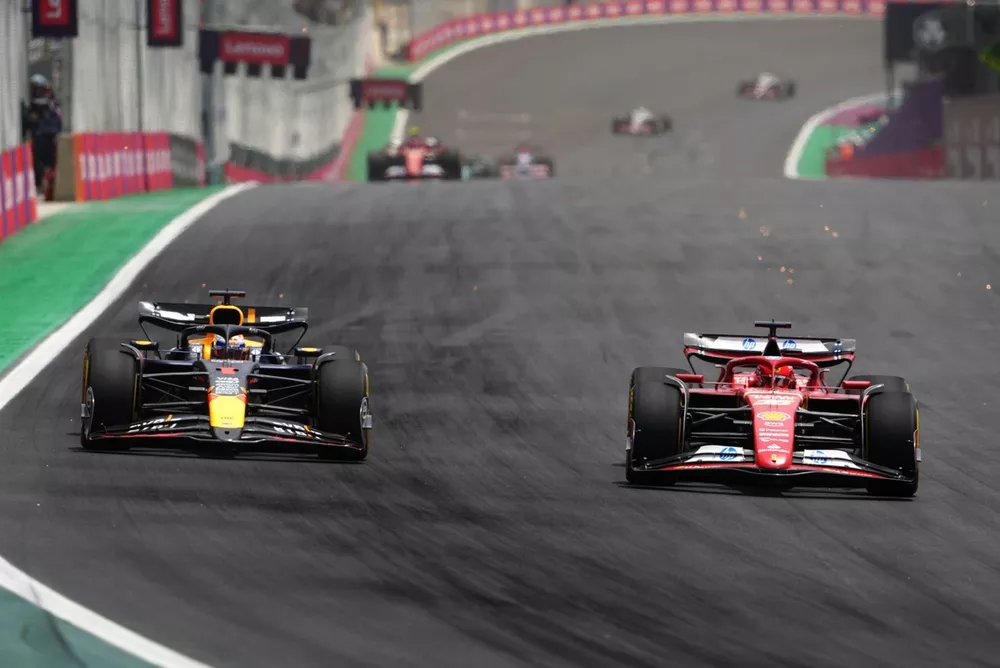 Max Verstappen, Red Bull Racing RB20 battles with Charles Leclerc, Ferrari SF-24 