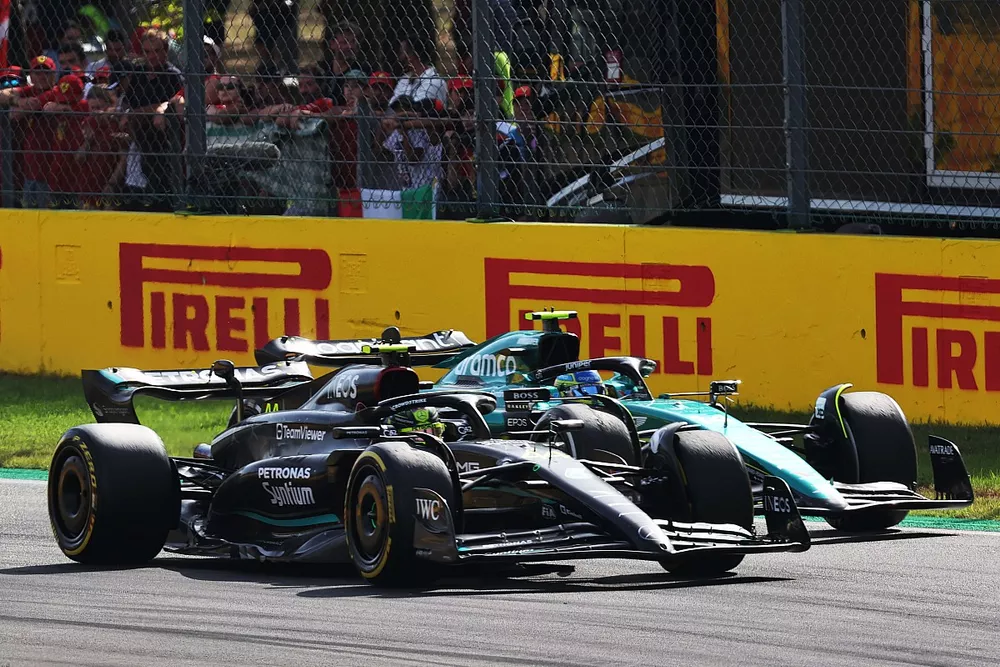 Lewis Hamilton, Mercedes F1 W14, leads Fernando Alonso, Aston Martin AMR23