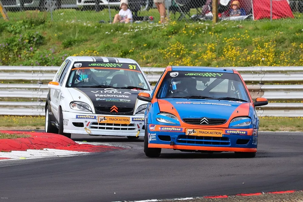 Daire Flock (22) won the first Junior Saloon Car race ahead of Cameron Pratt-Thompson (37)
