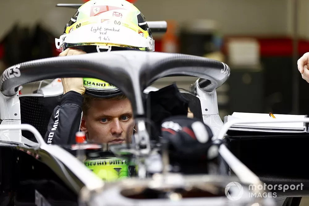 Mick Schumacher sits in his Haas VF-20 for his seat fitting.