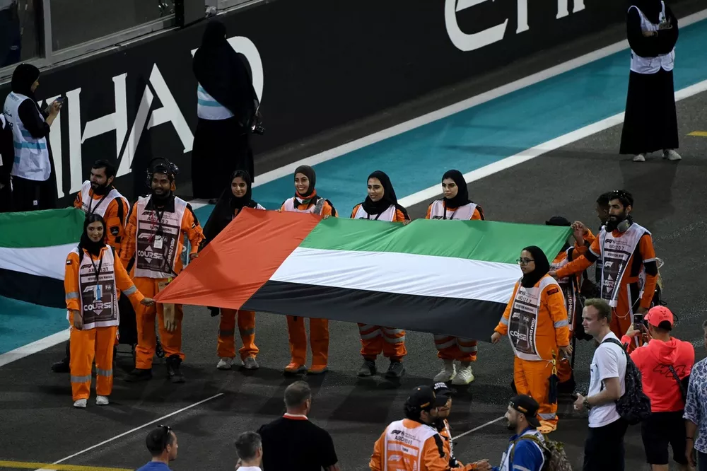 Marshals on the gri with the national flag