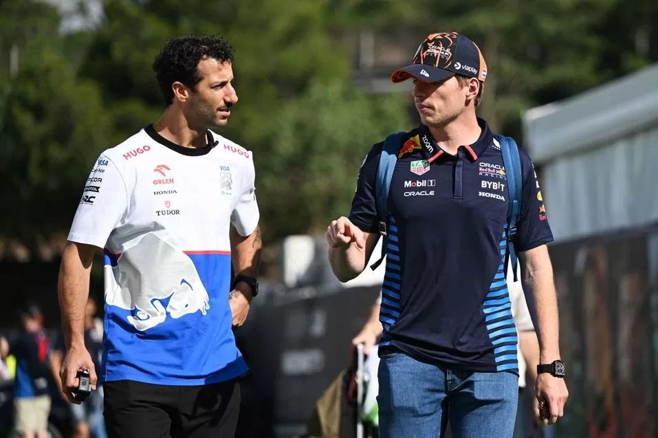 Daniel Ricciardo, Visa Cash App RB F1 Team, talks with Max Verstappen, Red Bull Racing