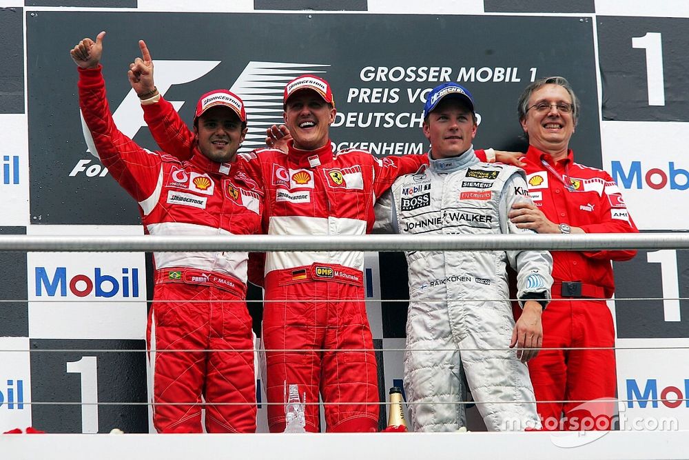 The podium: Felipe Massa, Ferrari, second; Michael Schumacher, Ferrari, race winner; Kimi Raikkonen, McLaren, third; Paolo Martinelli, Ferrari Engine Director