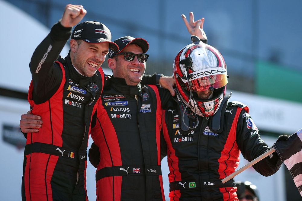 Laurens Vanthoor, Nick Tandy and Felipe Nasr drivers of The #7 Porsche Penske Motorsports Porsche 963 celebrate winning the Rolex 24