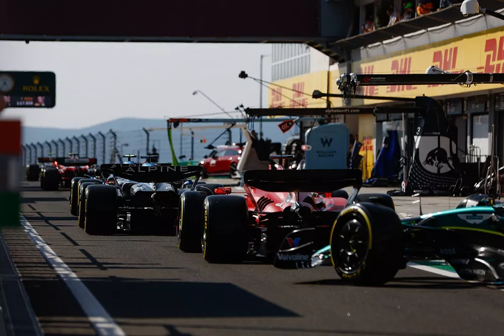 Pierre Gasly, Alpine A523, Esteban Ocon, Alpine A523, Charles Leclerc, Ferrari SF-23, in the queue to leave the pits