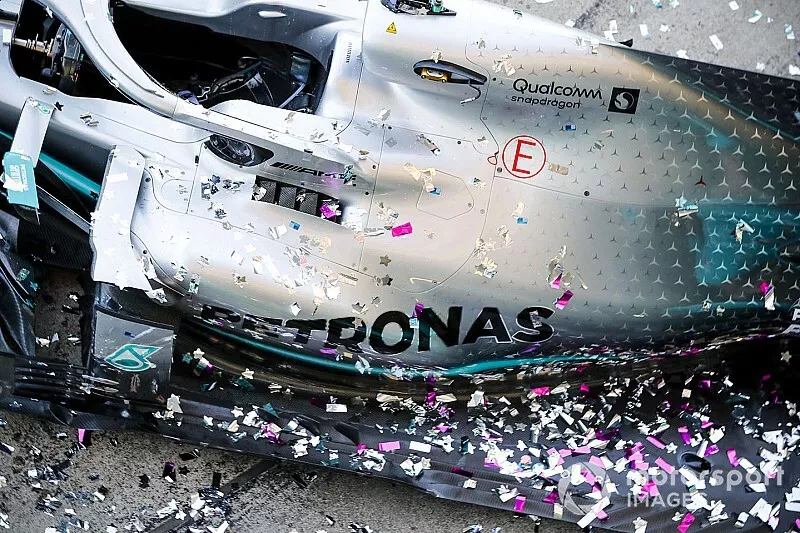 The Mercedes team celebrates victory in the race and the Constructors championship