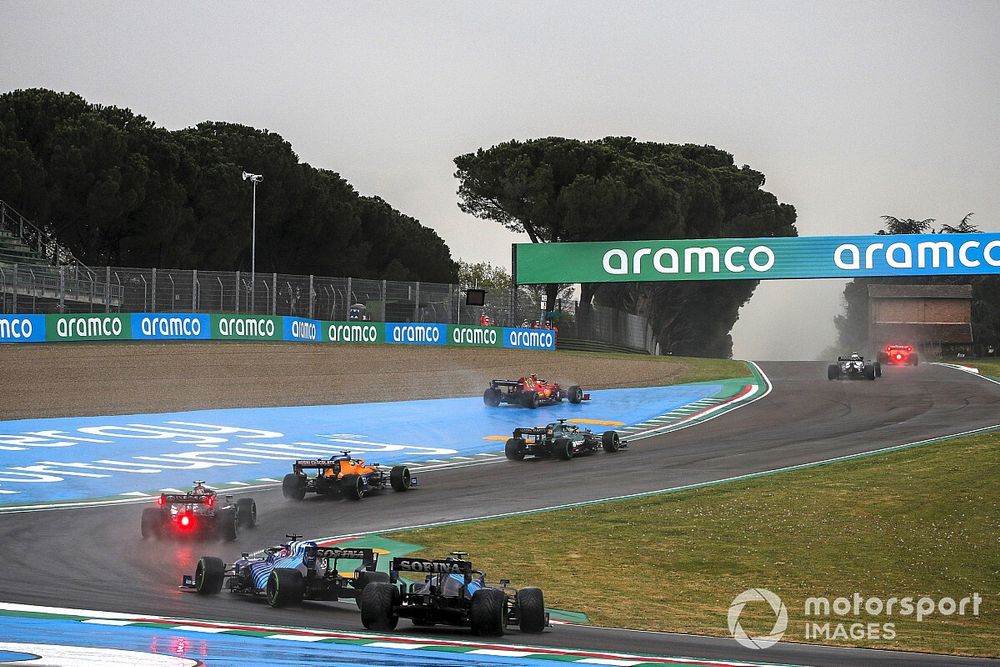 Carlos Sainz Jr., Ferrari SF21, runs wide ahead of Lance Stroll, Aston Martin AMR21, Lando Norris, McLaren MCL35M, Valtteri Bottas, Mercedes W12, and Fernando Alonso, Alpine A521, as Nicholas Latifi, Williams FW43B, spins