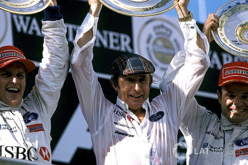 The Stewart Grand Prix team celebrate their first and third places at the European Grand Prix on the