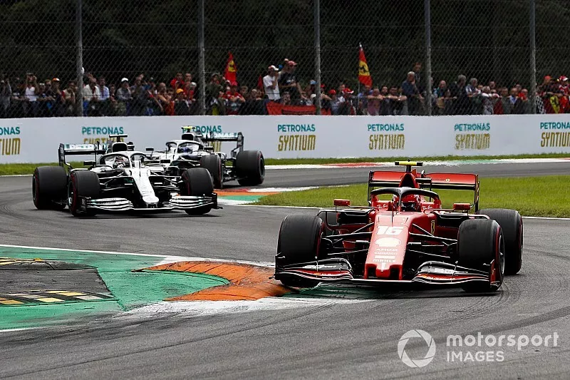 Charles Leclerc, Ferrari SF90, leads Lewis Hamilton, Mercedes AMG F1 W10, and Valtteri Bottas, Mercedes AMG W10