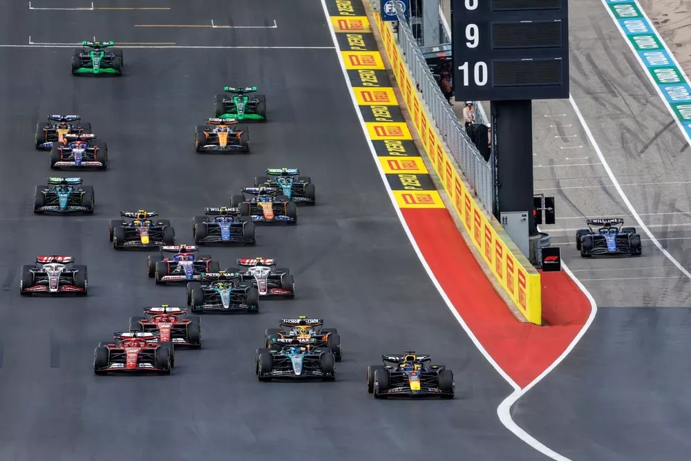 Max Verstappen, Red Bull Racing RB20, George Russell, Mercedes F1 W15, Charles Leclerc, Ferrari SF-24, Lando Norris, McLaren MCL38, Carlos Sainz, Ferrari SF-24, Kevin Magnussen, Haas VF-24, the rest of the field at the start of the Sprint race