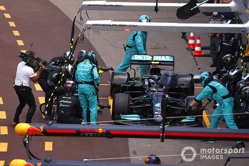 Valtteri Bottas, Mercedes W12, in the pits with technical issues relating to his front right wheel