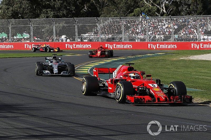 Sebastian Vettel, Ferrari SF71H leads Lewis Hamilton, Mercedes-AMG F1 W09