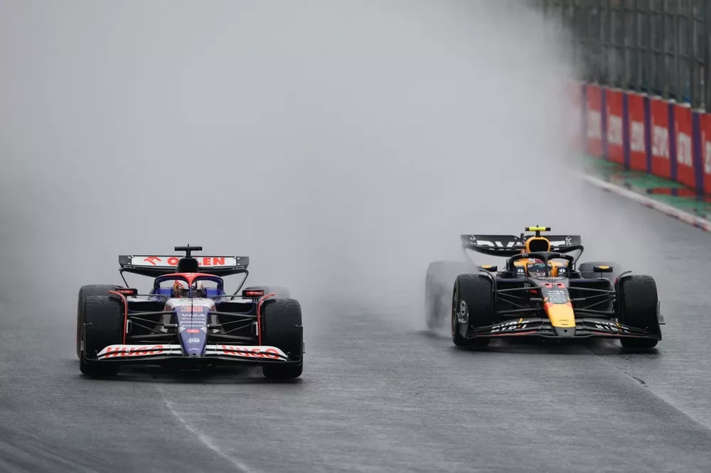 Liam Lawson, RB F1 Team VCARB 01, battles with Sergio Perez, Red Bull Racing RB20