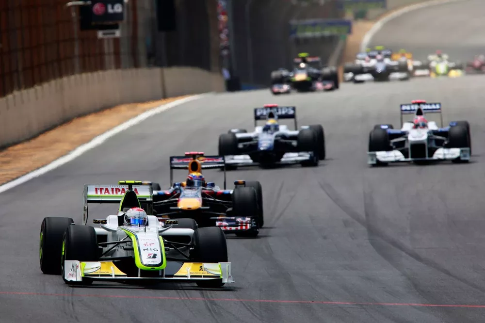 Rubens Barrichello, Brawn GP BGP001 Mercedes, 8th position, leads Mark Webber, Red Bull Racing RB5 Renault, 1st position, Nico Rosberg, Williams FW31 Toyota, retired, and Robert Kubica, BMW Sauber F1.09