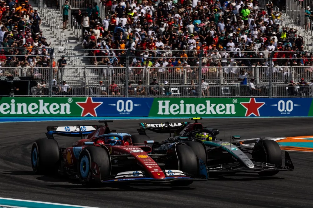 Sir Lewis Hamilton, Mercedes F1 W15, battles with Charles Leclerc, Ferrari SF-24