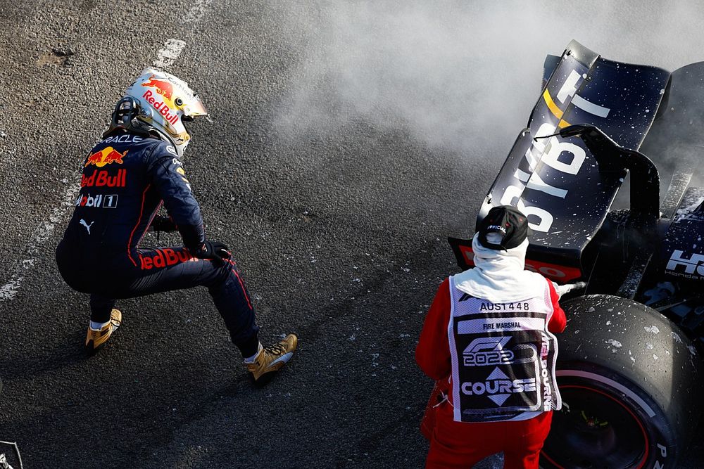 Max Verstappen, Red Bull Racing, retires from the race and a marshal assists with a fire