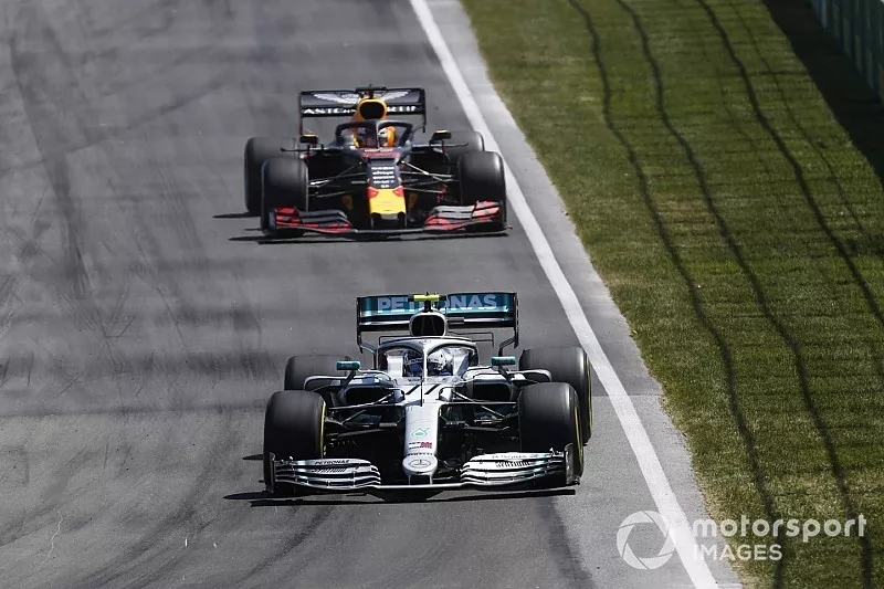 Valtteri Bottas, Mercedes AMG W10, leads Max Verstappen, Red Bull Racing RB15