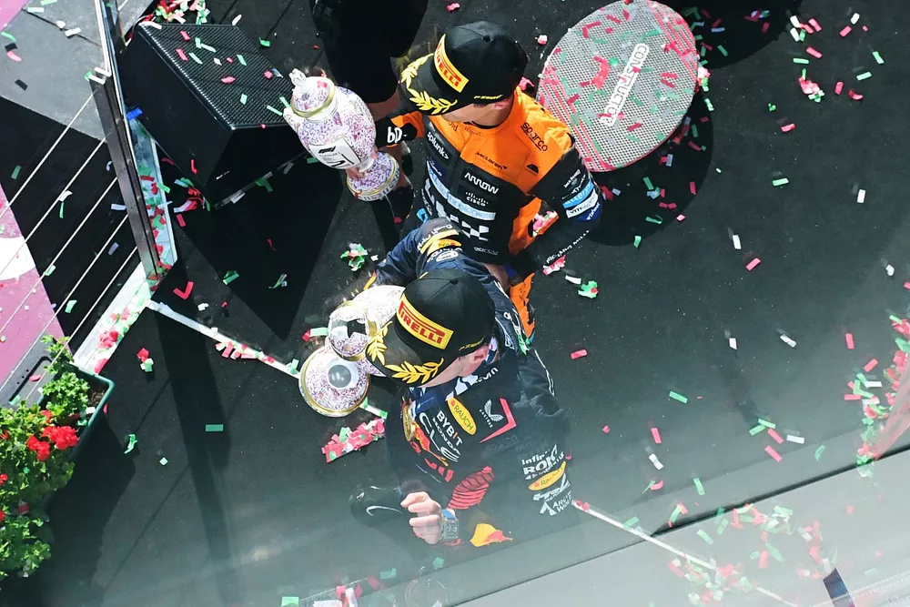 Max Verstappen, Red Bull Racing, 1st position, Lando Norris, McLaren, 2nd position, on the podium with their trophies