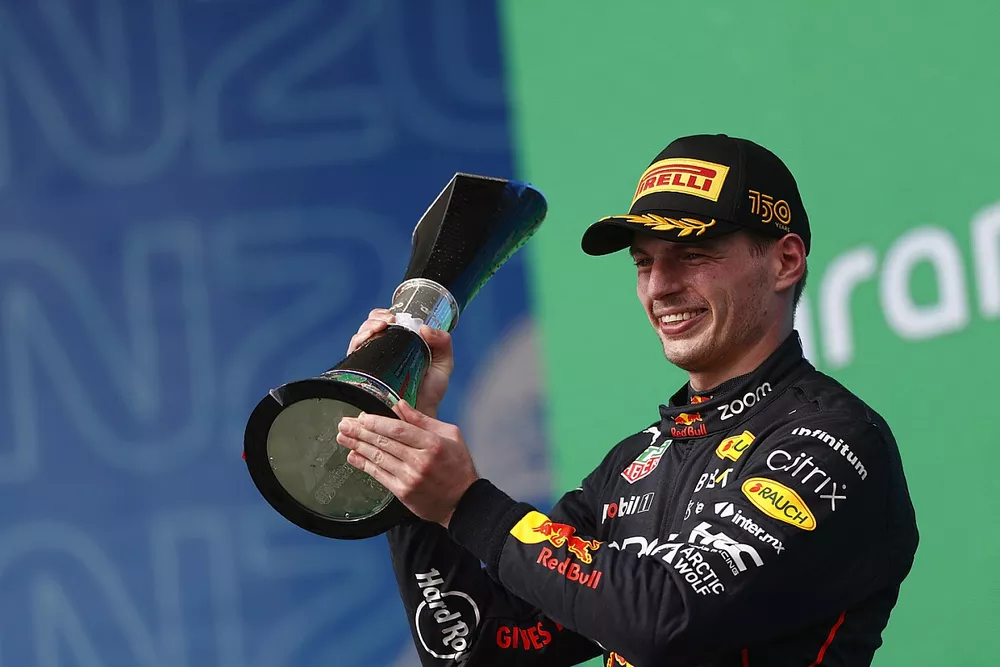 Max Verstappen, Red Bull Racing, 1st position, on the podium with the winners trophy