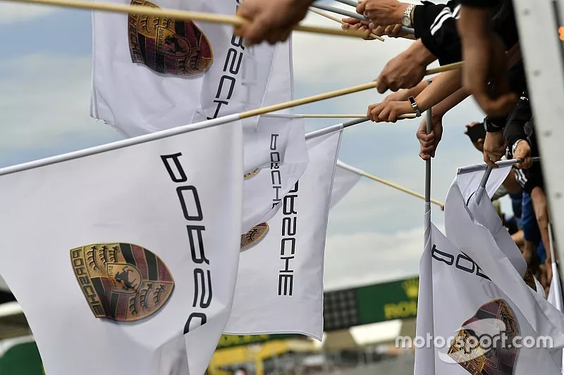 #77 Proton Competition Porsche 911 RSR: Christian Ried, Julien Andlauer, Matt Campbell celebrate the win with Porsche flags