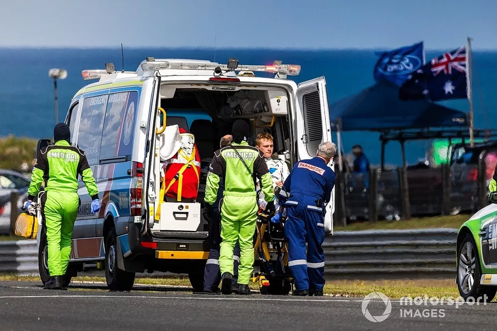 Nathan Herne is taken to hospital in an ambulance
