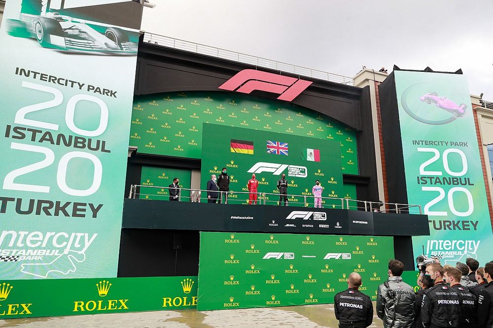 Toto Wolff, Executive Director (Business), Mercedes AMG, Sebastian Vettel, Ferrari, 3rd position, Lewis Hamilton, Mercedes-AMG F1, 1st position, and Sergio Perez, Racing Point, 2nd position, on the podium