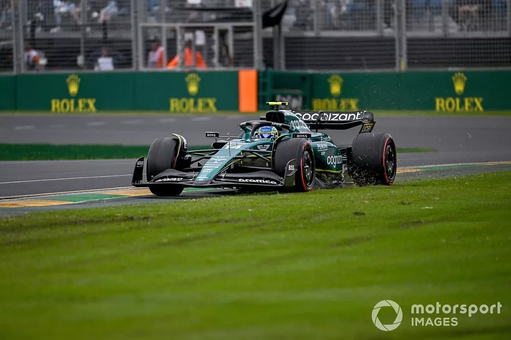 Fernando Alonso, Aston Martin AMR23, on the grass