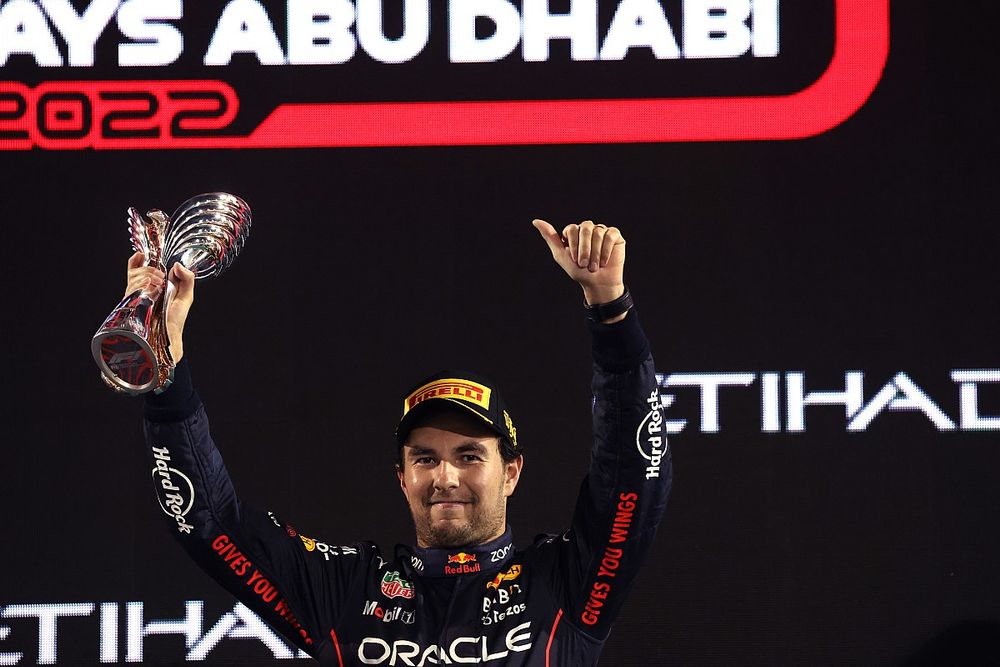 Sergio Perez, Red Bull Racing, 3rd position, lifts his trophy