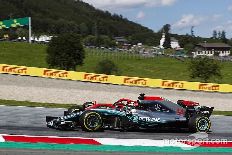 Sebastian Vettel, Ferrari SF71H, passes Lewis Hamilton, Mercedes AMG F1 W09