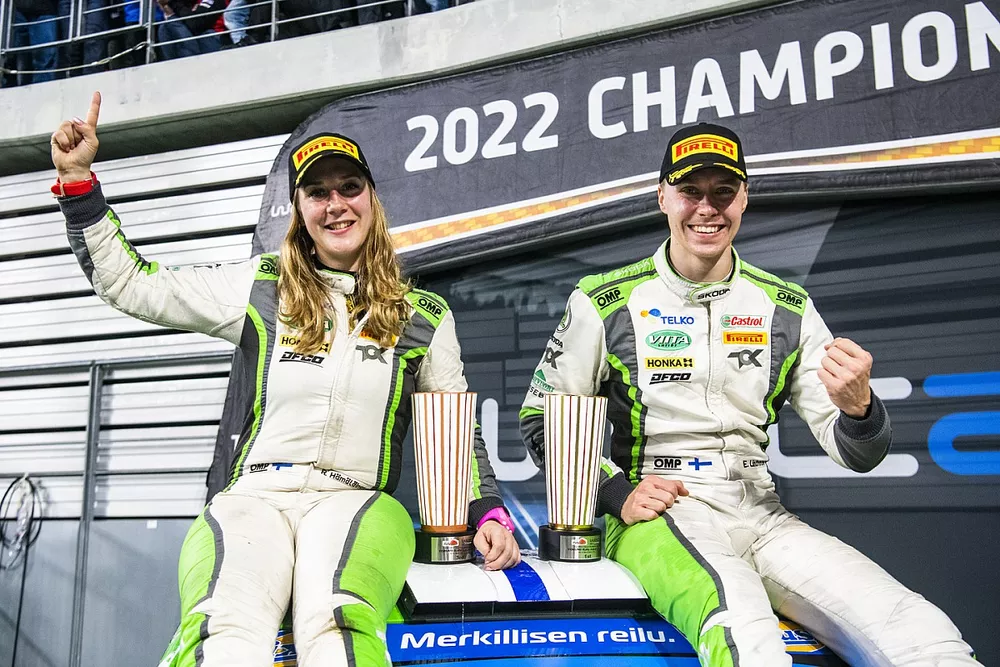 Reeta Hamalainen and Emil Lindholm celebrate their WRC2 world championship title victory