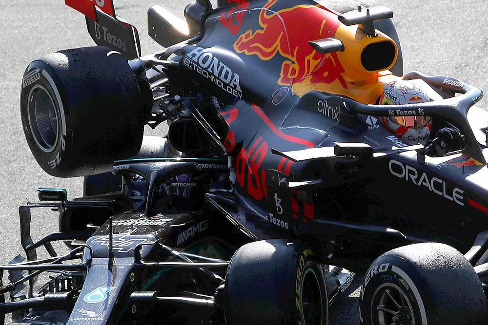 Max Verstappen, Red Bull Racing RB16B, and Lewis Hamilton, Mercedes W12, crash out