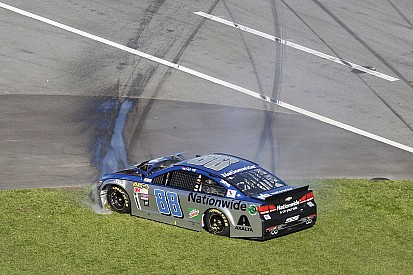 Dale Earnhardt Jr. pounds the inside wall late in the Daytona 500