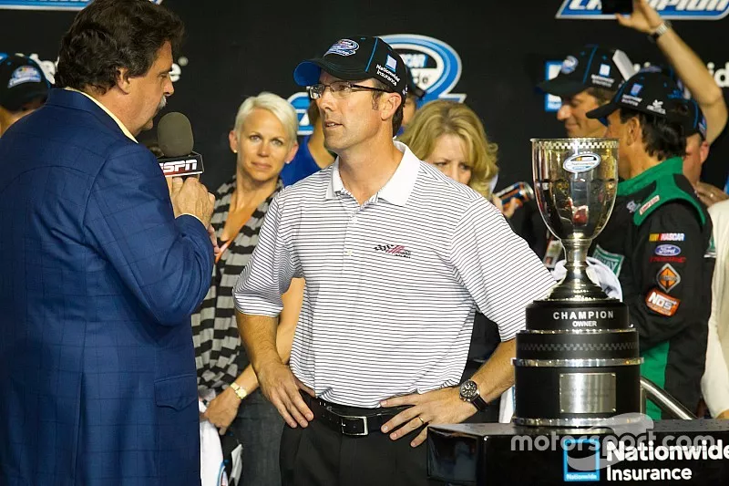 Championship victory lane: 2012 NASCAR Nationwide Series champion car owner trophy to J.D. Gibbs for Joe Gibbs Racing Toyota