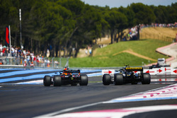 Daniel Ricciardo, Red Bull Racing RB14, passes Carlos Sainz Jr., Renault Sport F1 Team R.S. 18