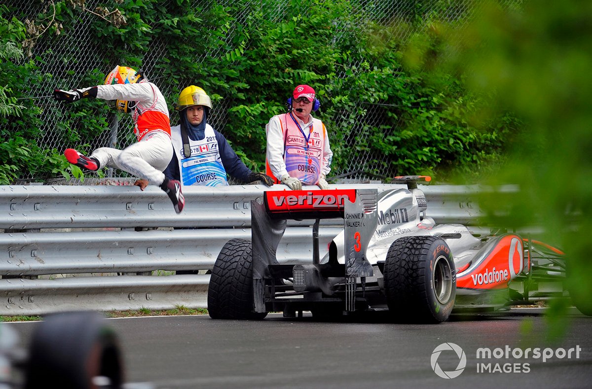 Lewis Hamilton, McLaren MP4-26 Mercedes, retired, leaps the barrier after parking his damaged car 