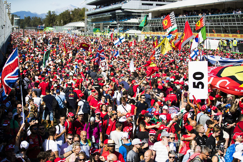 A huge sea of mainly Ferrari fans invade the circuit after the race