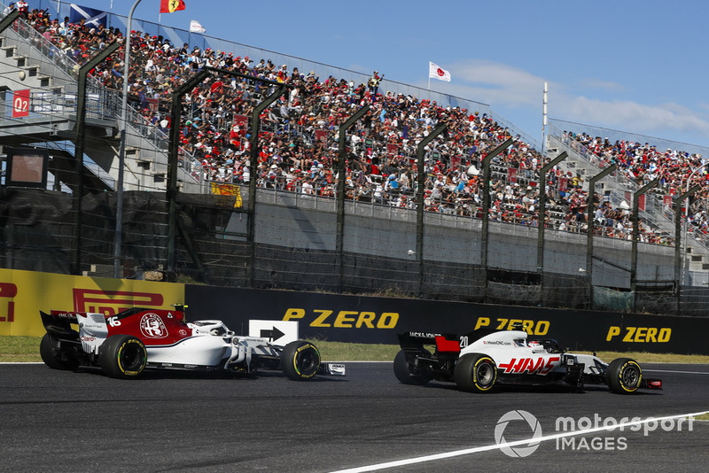 Kevin Magnussen, Haas F1 Team VF-18, leads Charles Leclerc, Sauber C37 